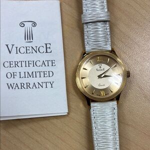 Ladies 18 k Gold Watch with cream band